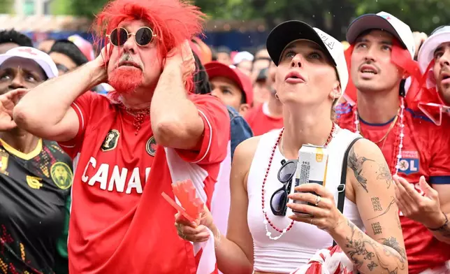 Fans watch the action during the first half of Canada's World Cup soccer match against Morocco at FIFA Fan Fest in Toronto on Saturday, July 4, 2026. (Jon Blacker/The Canadian Press via AP)