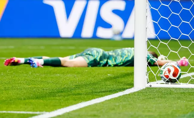 England goalkeeper Jordan Pickford lies on the pitch after Congo's Brian Cipenga scored his side's first goal during the World Cup round of 32 soccer match in Atlanta, Wednesday, July 1, 2026. (AP Photo/Erik S. Lesser)