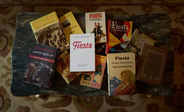 Books by Ernest Hemingway are photographed in the Ernest Hemingway Suite at the Gran Hotel La Perla in Pamplona, northern Spain, Thursday, July 2, 2026. (AP Photo/Miguel Oses)