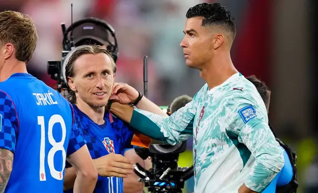 Croatia's Luka Modric (10) and Portugal's Cristiano Ronaldo (7) greet each other after the World Cup round of 32 soccer match between Portugal and Croatia in Toronto, Thursday, July 2, 2026. (Frank Gunn/The Canadian Press via AP)