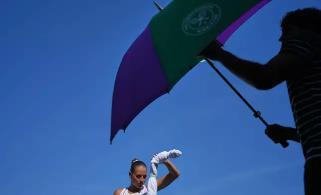 Marta Kostyuk of Ukraine uses an icepack during the second round women's singles match against Anna Blinkova of Russia at the Wimbledon Tennis Championships in London, Thursday, July 2, 2026.(AP Photo/Kin Cheung)