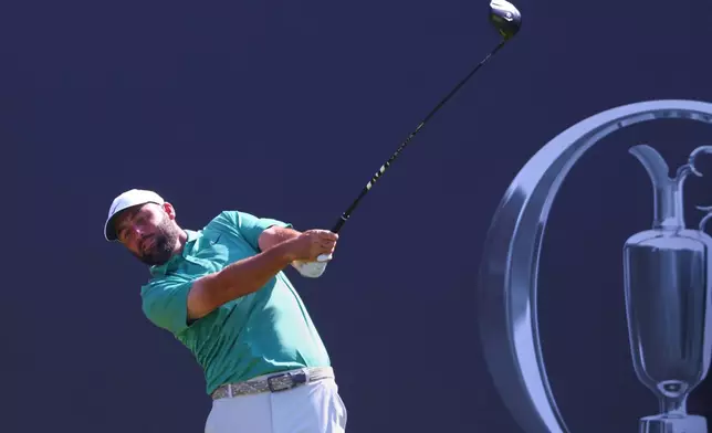 Scottie Scheffler of the United States tees off from the 1st hole during a practice round for the British Open Golf championships at Royal Birkdale golf club, in Southport, England, Tuesday, July 14, 2026. (AP Photo/Peter Morrison)
