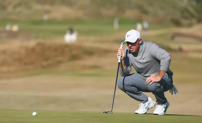 Rory McIlroy of Northern Ireland looks at the lie of his putt on the 8th green during a practice round for the British Open Golf championships at Royal Birkdale golf club, in Southport, England, Tuesday, July 14, 2026. (AP Photo/Peter Morrison)