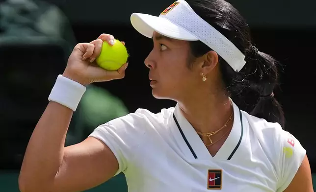 Alexandra Eala of the Philippines eyes the ball during the third round women's singles match against Iga Swiatek of Poland at the Wimbledon Tennis Championships in London, Saturday, July 4, 2026.(AP Photo/Maja Smiejkowska)