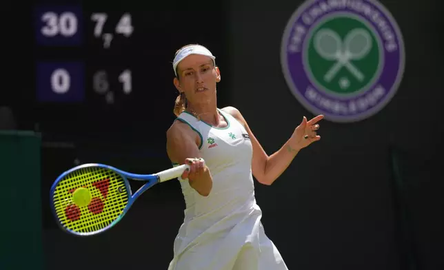 Elise Mertens of Belgium returns the ball to Elena Rybakina of Kazakhstan in their third round women's singles match at the Wimbledon Tennis Championships in London, Saturday, July 4, 2026. (AP Photo/Kirsty Wigglesworth)