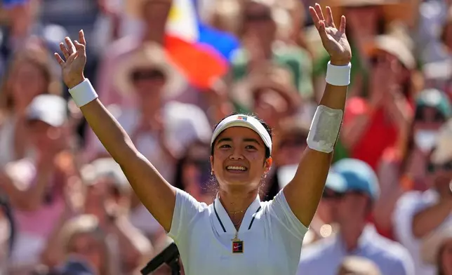 Alexandra Eala of the Philippines celebrates winning the third round women's singles match against Iga Swiatek of Poland at the Wimbledon Tennis Championships in London, Saturday, July 4, 2026.(AP Photo/Maja Smiejkowska)