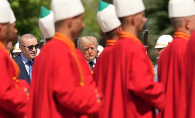 President Donald Trump, center, and Turkish President Recep Tayyip Erdogan, left, during a formal welcome at the Bestepe Presidential Palace during the NATO summit in Ankara, Turkey, Tuesday, July 7, 2026. (AP Photo/Francisco Seco)
