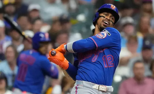 New York Mets' Francisco Lindor strikes out during the sixth inning of a baseball game against the Milwaukee Brewers, Monday, July 20, 2026, in Milwaukee. (AP Photo/Aaron Gash)