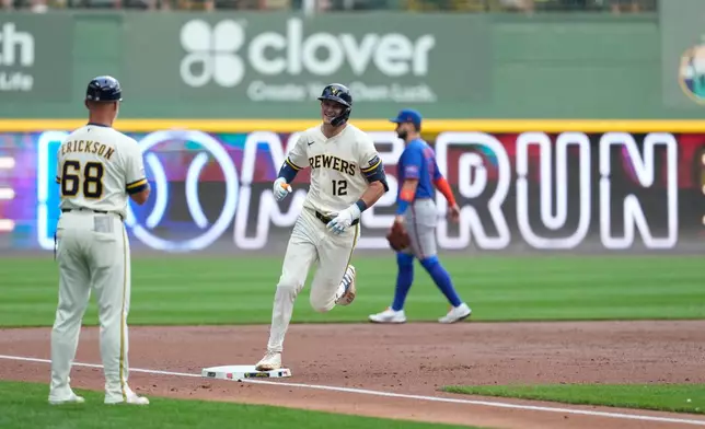 Milwaukee Brewers' Cooper Pratt (12) smiles as he rounds the bases after hitting a solo home run during the second inning of a baseball game against the New York Mets, Monday, July 20, 2026, in Milwaukee. (AP Photo/Aaron Gash)