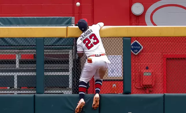 Atlanta Braves center fielder Michael Harris II fails to catch a solo home run hit by New York Mets' A.J. Ewing during the second inning of a baseball game, Sunday, July 5, 2026, in Atlanta. (AP Photo/Erik S. Lesser)