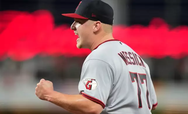 Cleveland Guardians starting pitcher Parker Messick (77) reacts after Miami Marlins' Joe Mack was out a first on a ground out during the fifth inning of a baseball game, Friday, July 10, 2026, in Miami. (AP Photo/Lynne Sladky)