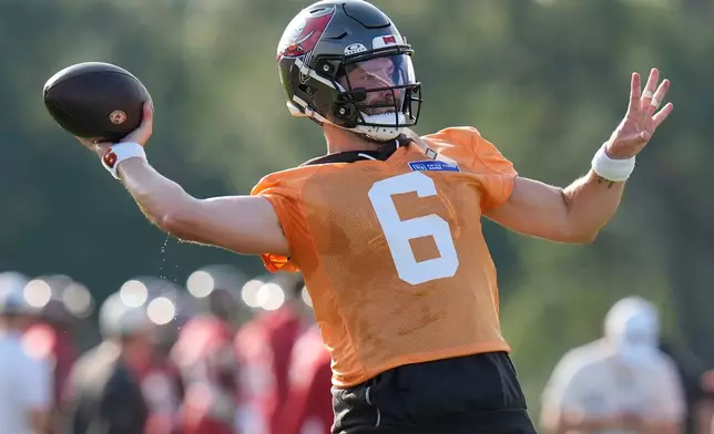 Tampa Bay Buccaneers quarterback Baker Mayfield throws a pass during an NFL football training camp practice Wednesday, July 29, 2026, in Tampa, Fla. (AP Photo/Chris O'Meara)