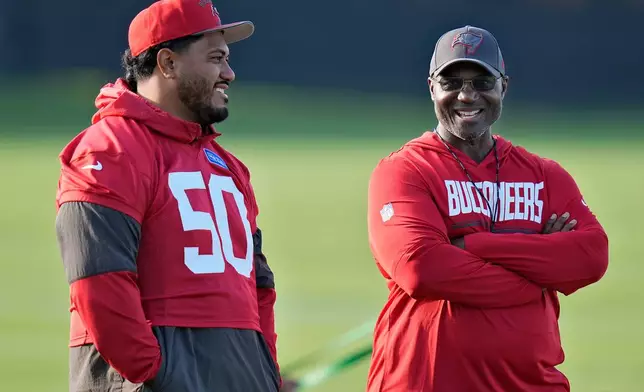 Tampa Bay Buccaneers head coach Todd Bowles talks to defensive tackle Vita Vea (50) during an NFL football training camp practice Wednesday, July 29, 2026, in Tampa, Fla. (AP Photo/Chris O'Meara)