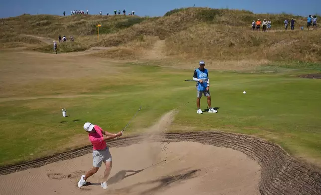 Collin Morikawa of the United States plays out of a bunker on the 11th green during a practice round for the British Open Golf championships at Royal Birkdale golf club, in Southport, England, Tuesday, July 14, 2026. (AP Photo/Jon Super)