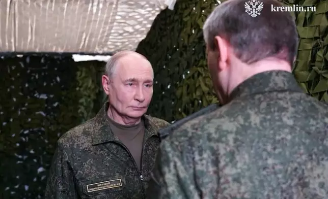 In this image taken from video provided by Russian Presidential Press Service on Friday, July 3, 2026. Russian President Vladimir Putin, left, listens to a report of Russian Chief of General Staff Gen. Valery Gerasimov as he visits one of the command posts of the Joint Group of the Russian Forces, in an undisclosed location. (Russian Presidential Press Service via AP)