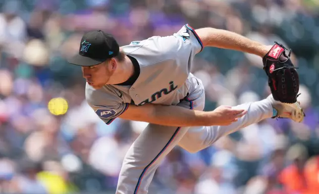 Miami Marlins starting pitcher Ryan Gusto works against the Colorado Rockies in the first inning of a baseball game Thursday, July 2, 2026, in Denver. (AP Photo/David Zalubowski)