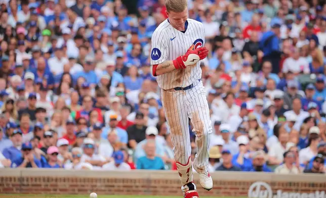 Chicago Cubs' Pete Crow-Armstrong reacts after being hit by a pitch during the second inning of a baseball game against the St. Louis Cardinals, Sunday, July 5, 2026, in Chicago. (AP Photo/Melissa Tamez)