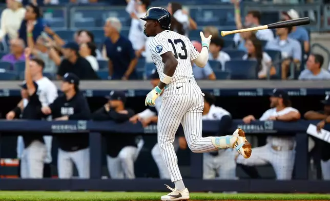 New York Yankees' Jazz Chisholm Jr. tosses his bat after hitting a home run against the Pittsburgh Pirates during the first inning of a baseball game, Monday, July 20, 2026, in New York. (AP Photo/Noah K. Murray)