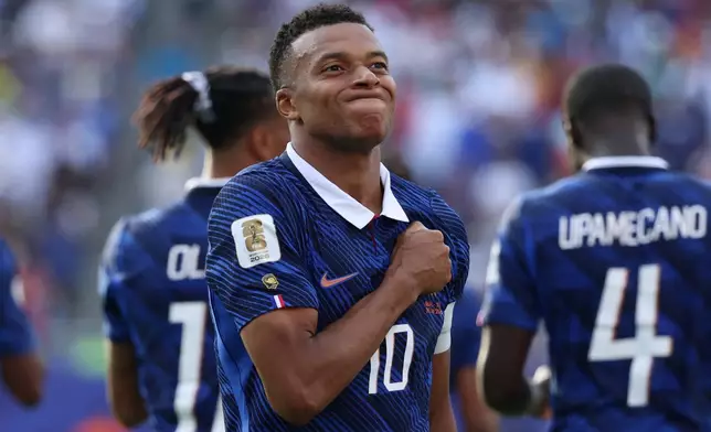 France's Kylian Mbappe (10) celebrates scoring their third goal during the World Cup round of 32 soccer match between France and Sweden in East Rutherford, N.J., near New York, Tuesday, June 30, 2026. (AP Photo/Pamela Smith)