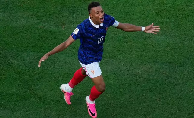 France's Kylian Mbappe (10) celebrates scoring their side's first goal during the World Cup round of 32 soccer match between France and Sweden in East Rutherford, N.J., near New York, Tuesday, June 30, 2026. (AP Photo/Yuki Iwamura)