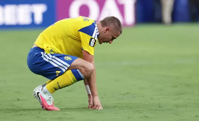 Sweden's Gustaf Lagerbielke (2) reacts after their loss in the World Cup round of 32 soccer match between France and Sweden in East Rutherford, N.J., near New York, Tuesday, June 30, 2026. (AP Photo/Adam Hunger)