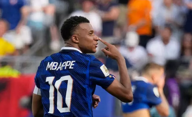 France's Kylian Mbappe reacts after scoring his side's opening goal during the World Cup round of 32 soccer match between France and Sweden in East Rutherford, N.J., near New York, Tuesday, June 30, 2026. (AP Photo/Seth Wenig)