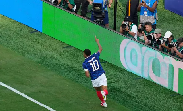 France's Kylian Mbappe (10) celebrates after scoring his side's third goal during the World Cup round of 32 soccer match between France and Sweden in East Rutherford, N.J., near New York, Tuesday, June 30, 2026. (AP Photo/Yuki Iwamura)
