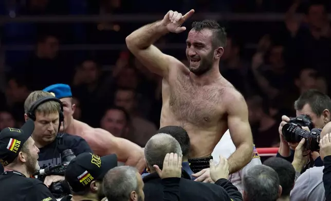 FILE - Russia's Murat Gassiev reacts after winning the IBF cruiserweight title bout against Russia's Denis Lebedev in Moscow, Russia, on Saturday, Dec. 3, 2016. (AP Photo/Ivan Sekretarev, File)