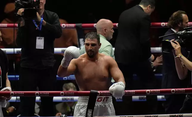 FILE - Germany's Agit Kabayel reacts after beating Cuba's Frank Sanchez during their Heavyweight boxing fight, at the Kingdom Arena in Riyadh, Saudi Arabia, Saturday, May 18, 2024. (AP Photo/Francisco Seco, File)