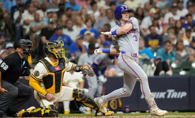 New York Mets' Carson Benge hits a two-run single during the fifth inning of a baseball game against the Milwaukee Brewers, Tuesday, July 21, 2026, in Milwaukee. (AP Photo/Aaron Gash)