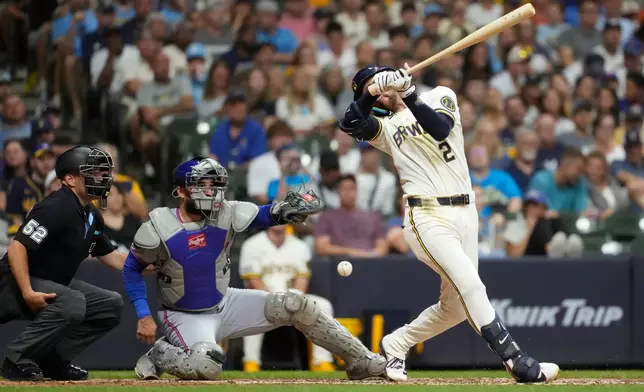 Milwaukee Brewers' Brice Turang hits a foul ball during the sixth inning of a baseball game against the New York Mets, Tuesday, July 21, 2026, in Milwaukee. (AP Photo/Aaron Gash)