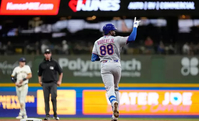New York Mets' Luis Robert Jr. rounds the bases after hitting a solo home run during the eighth inning of a baseball game against the Milwaukee Brewers, Tuesday, July 21, 2026, in Milwaukee. (AP Photo/Aaron Gash)