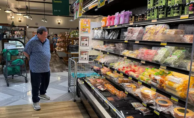 A customer shops at a grocery store in Arlington Heights, Ill., Monday, July 6, 2026. (AP Photo/Nam Y. Huh)