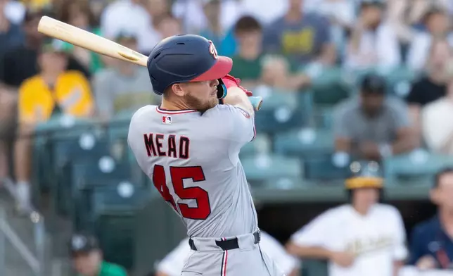 Washington Nationals' Curtis Mead hits a two RBI double during the third inning of a baseball game against the Athletics Friday, July 17, 2026, in West Sacramento, Calif. (AP Photo/Sara Nevis)