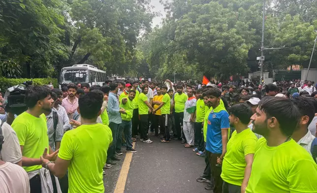 Supporters of the Cockroach Janta Party gather to march to India's Parliament, demanding the resignation of the education minister, in New Delhi, Monday, July 20, 2026.(AP Photo/Manish Swarup)