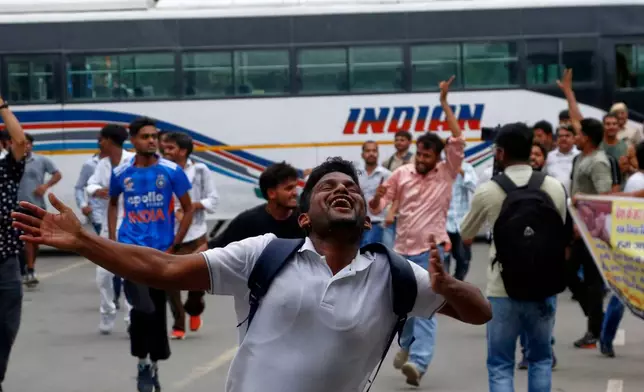 Supporters of the Cockroach Janta Party attempt to march to India's Parliament, demanding the resignation of the education minister, in New Delhi, Monday, July 20, 2026. (AP Photo/Shekhar Yadav)