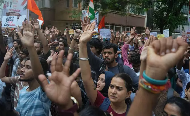 Supporters of the Cockroach Janta Party shout slogans during a protest demanding the resignation of Education Minister Dharmendra Pradhan over alleged examination irregularities and repeated paper leaks in Mumbai, India, Sunday, July 19, 2026. (AP Photo/Rafiq Maqbool)