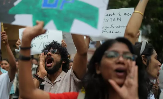 Supporters of the Cockroach Janta Party shout slogans during a protest demanding the resignation of Education Minister Dharmendra Pradhan over alleged examination irregularities and repeated paper leaks in Mumbai, India, Sunday, July 19, 2026. (AP Photo/Rafiq Maqbool)