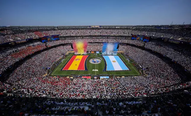 National flag of Spain and Argentina are displayed as smoke the color of the countries are set off before the World Cup final soccer match between Spain and Argentina in East Rutherford, N.J., near New York, Sunday, July 19, 2026. (AP Photo/Matt Slocum)