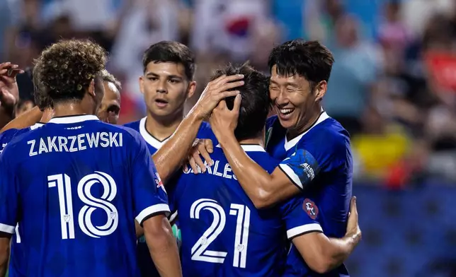 MLS All-Star Son Heung-min (7) celebrates after scoring with Carles Gil (21) during the MLS All-Star soccer game Wednesday, July 29, 2026, in Charlotte, N.C. (AP Photo/Scott Kinser)