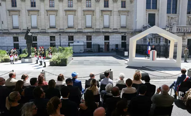 France's President Emmanuel Macron delivers a speech during a tribute ceremony to Captain Alfred Dreyfus on the first national day dedicated to the recognition of his innocence by the Court of Cassation in 1906, and the fight against the resurgence of antisemitism, 120 years later, on the Ile de la Cite near the Cour de Cassation in Paris, Sunday, July 12, 2026. (Thomas Samson/Pool Photo via AP)