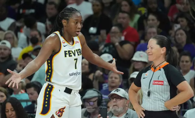 Indiana Fever center-forward Aliyah Boston (7) argues with a referee during the second half of a WNBA basketball game against the Phoenix Mercury, Thursday, July 9, 2026, in Phoenix. (AP Photo/Ross D. Franklin)