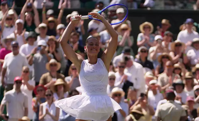 Marta Kostyuk of Ukraine dances to celebrate her victory against Jasmine Paolini of Italy in their quarter-final women's singles match at the Wimbledon Tennis Championships in London, Wednesday, July 8, 2026. (AP Photo/Brian Inganga)