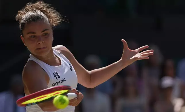 Jasmine Paolini of Italy returns the ball to Marta Kostyuk of Ukraine in their quarter-final women's singles match at the Wimbledon Tennis Championships in London, Wednesday, July 8, 2026. (AP Photo/Brian Inganga)