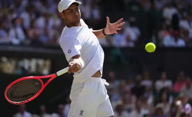 Flavio Cobolli of Italy returns the ball to Arthur Fery of Britain in their quarter-final men's singles match at the Wimbledon Tennis Championships in London, Wednesday, July 8, 2026. (AP Photo/Brian Inganga)