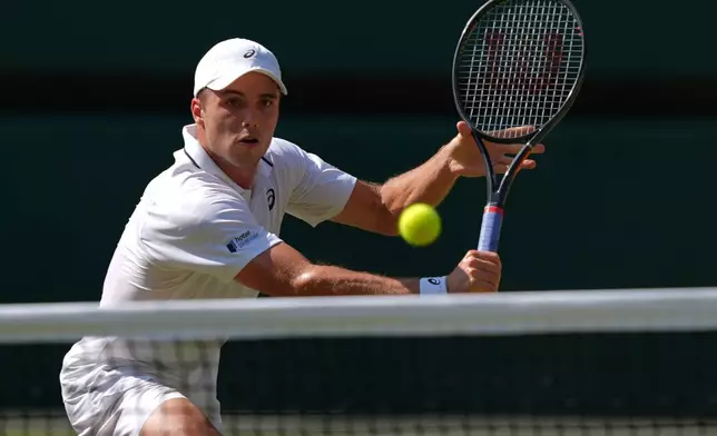 Arthur Fery of Britain plays a volley against Flavio Cobolli of Italy in their quarter-final men's singles match at the Wimbledon Tennis Championships in London, Wednesday, July 8, 2026. (AP Photo/Maja Smiejkowska)
