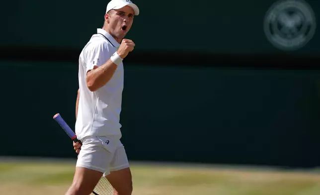 Arthur Fery of Britain celebrates winning a point against Flavio Cobolli of Italy in their quarter-final men's singles match at the Wimbledon Tennis Championships in London, Wednesday, July 8, 2026. (AP Photo/Maja Smiejkowska)