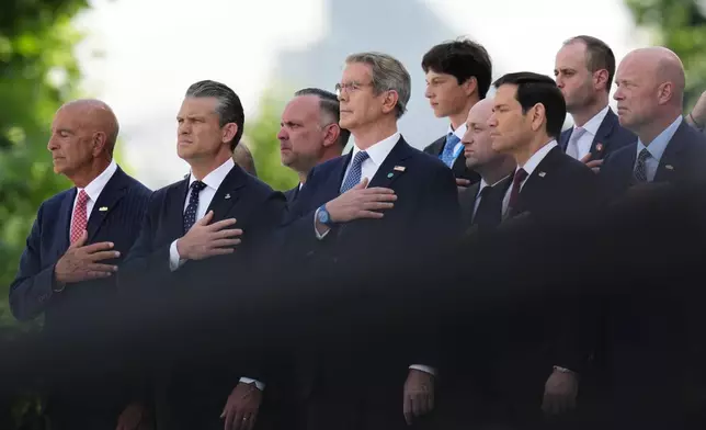 Front row from left, U.S. Ambassador to Turkey Tom Barrack, U.S. Defense Secretary Pete Hegseth, U.S. Treasury Secretary Scott Bessent, U.S. Secretary of State Marco Rubio and U.S. Ambassador to NATO Matthew G. Whitaker attend the formal welcome for President Donald Trump at the NATO summit at the Bestepe Presidential Palace in Ankara, Turkey, Tuesday, July 7, 2026. (AP Photo/Francisco Seco)
