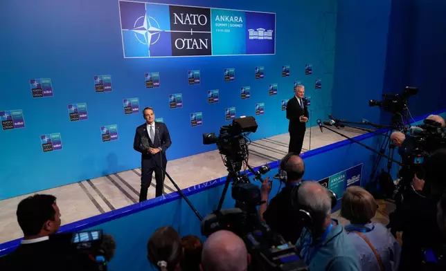 Greece's Prime Minister Kyriakos Mitsotakis, left, and Lithuania's President Gitanas Nauseda speak with the media as they arrive for the NATO summit in Ankara, Turkey, Wednesday, July 8, 2026. (AP Photo/Emrah Gurel)