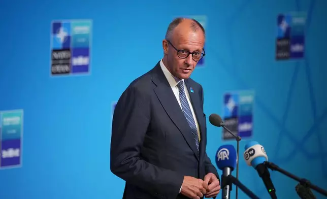 Germany's Chancellor Friedrich Merz speaks with the media as he arrives for the NATO summit in Ankara, Turkey, Wednesday, July 8, 2026. (AP Photo/Emrah Gurel)